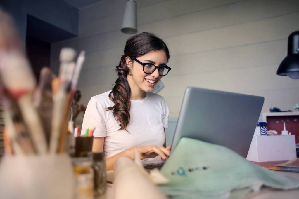 photo of woman using her laptop